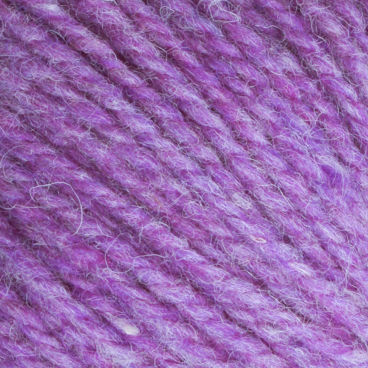 Close-up of Bartlettyarns Maine Wool Yarn (Fisherman 2-Ply) by Bartlettyarns, highlighting its textured purple strands and tightly wound fibers in a diagonal pattern.