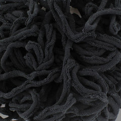Close-up of a tangled pile of Harrisville Potholder Loops - Traditional Size by Friendly Loom, resembling black fabric strands crafted into intricate patterns on a traditional loom, creating a textured and chaotic design.