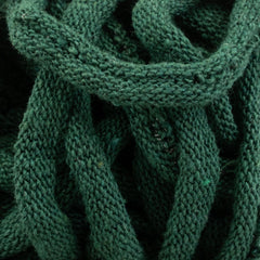 The image showcases a close-up of Harrisville Potholder Loops - Traditional Size by Friendly Loom, featuring a green knitted fabric with an intricate textured, looped pattern crafted from cotton loops. The focus is on the detailed weaving and vibrant green hue, emphasizing the soft, cozy texture reminiscent of a traditional loom design.