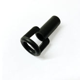 On a white background lies the Louët Scotch Tension Replacement Orifice by Louet Inc., a small black cylindrical object featuring a hollow tube and ring-like structure reminiscent of replacement parts for spinning equipment.