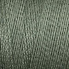 Close-up of sage green 8/2 Tencel Yarn | Mini-cone by Maurice Brassard, featuring tightly twisted fibers and a soft, smooth texture—ideal for weaving projects.