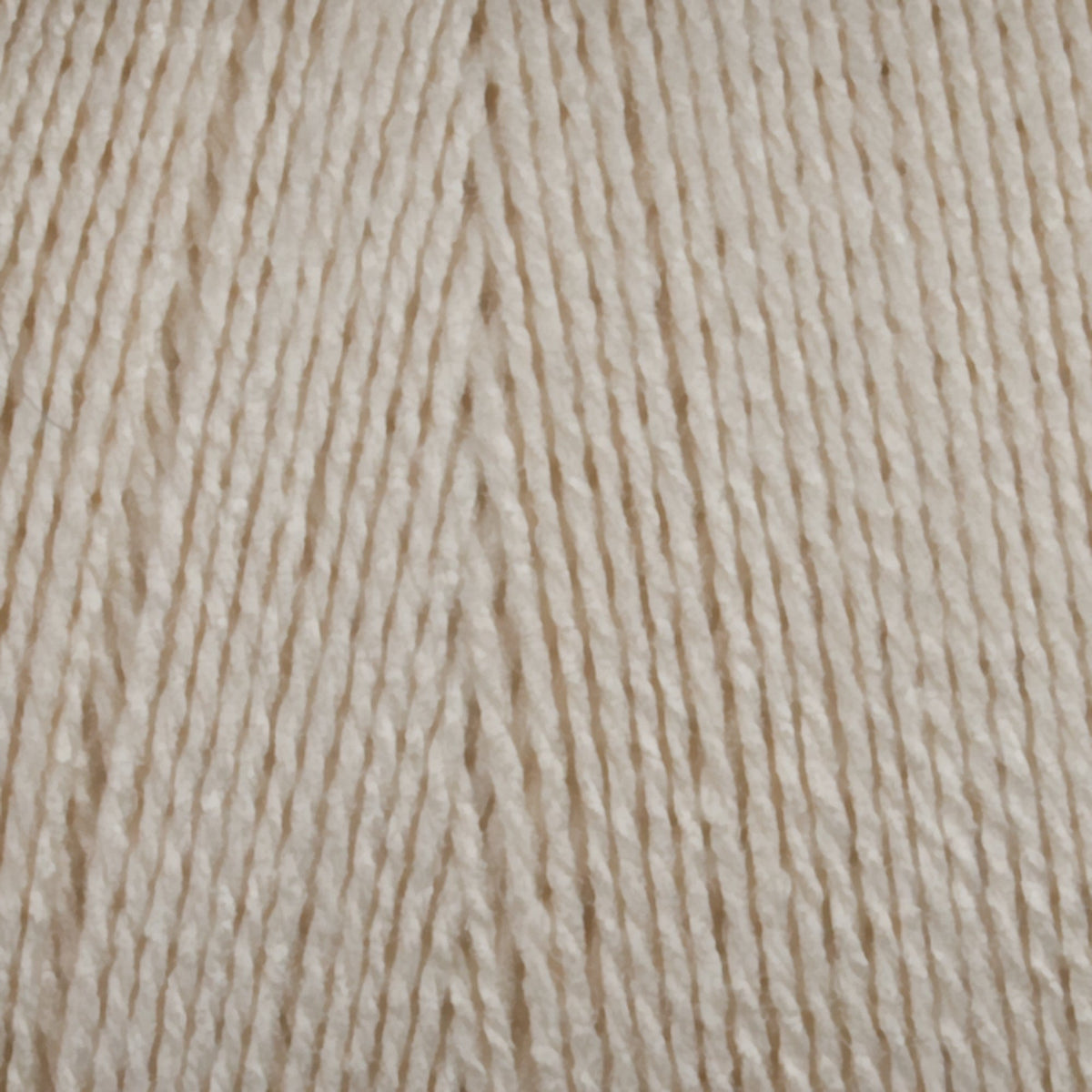 Close-up of 8/2 Tencel Yarn | Mini-cone by Maurice Brassard in beige/off-white, showing tightly wound strands and detailed texture—perfect for weaving projects.