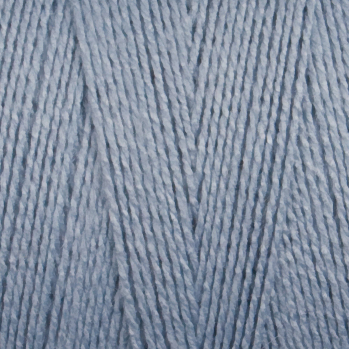 Close-up of Maurice Brassard 8/2 Tencel Yarn | Mini-cone in light blue, showing its fine cellulose fibers twisted into a soft, even weave—ideal for weaving projects.