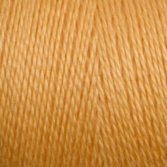 Close-up of Maurice Brassard 8/2 Tencel Yarn | Mini-cone in light orange-tan, highlighting its fine texture and tightly twisted strands—perfect for weaving projects.