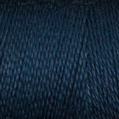 Close-up of Maurice Brassard 8/2 Tencel Yarn | Mini-cone in dark blue, highlighting its tightly twisted fibers and subtle texture—perfect for weaving projects.